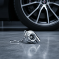 Silver Chrome Turbo Keychain in Automotive Setting